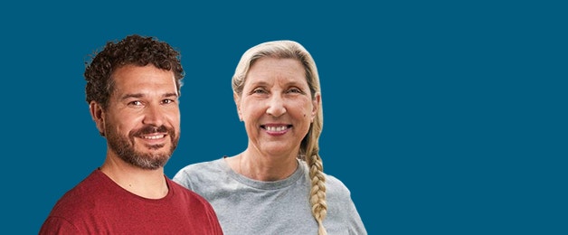 Two adults smiling to see how PREVNAR 20® can help provide protection against pneumococcal pneumonia for adults. See safety info.